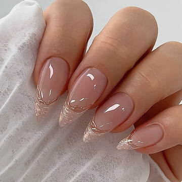 Glossy Almond Nude Tone with French Glitter and Golden Accents Nails